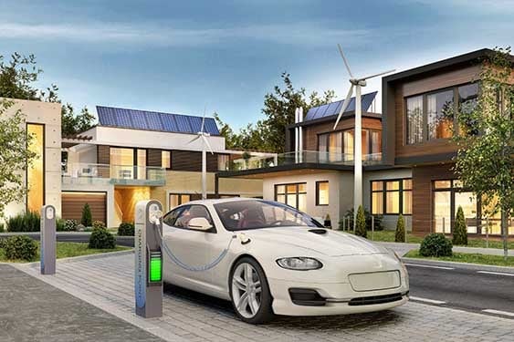 Connected home with an electric car and a wind mill along with an EV charging station.