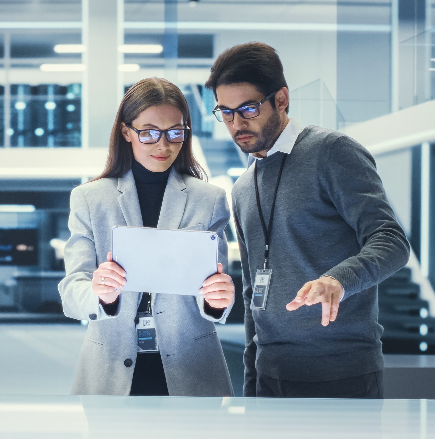 Engineers reviewing a performance report in a data control room.