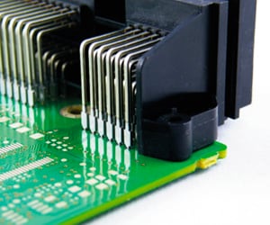 Pin header 90° with press-fit pins inserted into PCB