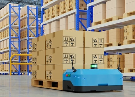 Floor robots carrying the packages inside the warehouse