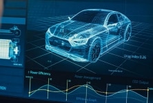 Engineer works on a CAD drawing of an electric vehicle's power infrastructure.