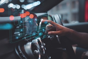 A man operates the software powering a car