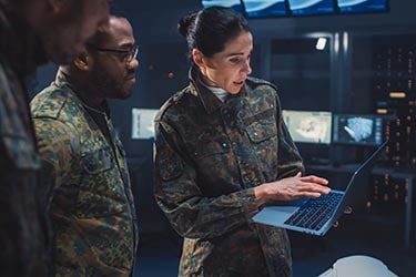 Engineers review design for industrial machinery.