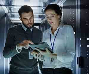 Engineers in a data center rack room.