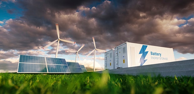 Wind turbine and solar panels at a renewable energy station.