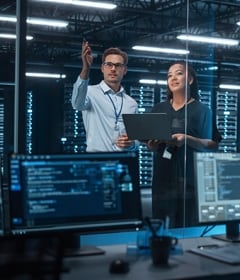 Data engineers discuss power needs for a data center to run AI technologies.