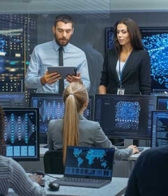 IT engineers in the control room of a data center run generative AI systems.