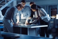 Engineers developing a design concept for a technological application.