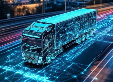 A data-connected smart truck on a highway at night.