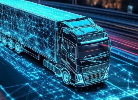 A data-connected smart truck on a highway at night.