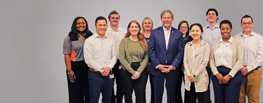CEO Terrence Curtin with TE employees.