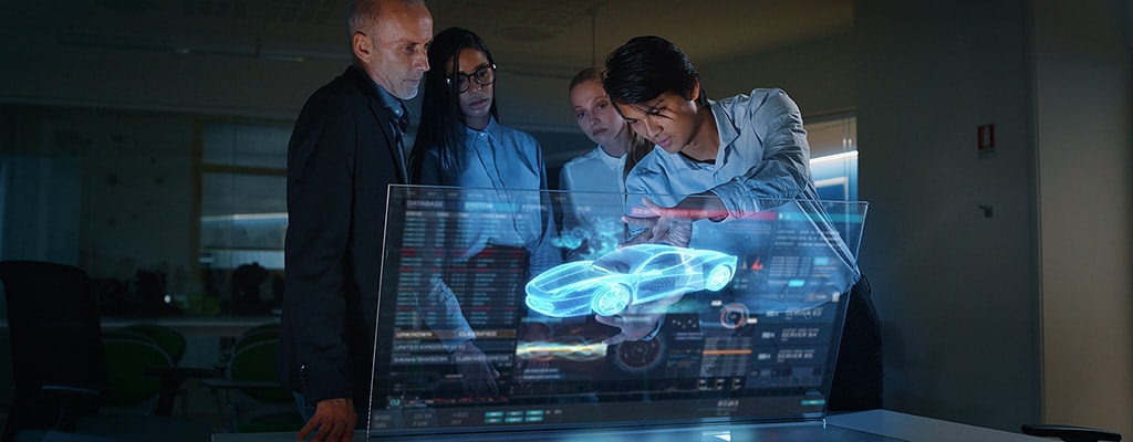 Engineer works on a CAD drawing of an electric vehicle's power infrastructure.