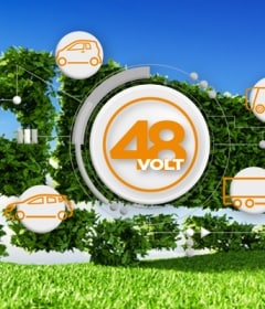 Tractor trailer made of leaves driving in field with blue skies with 48V logo