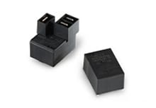 Two black T9G relays against a white background